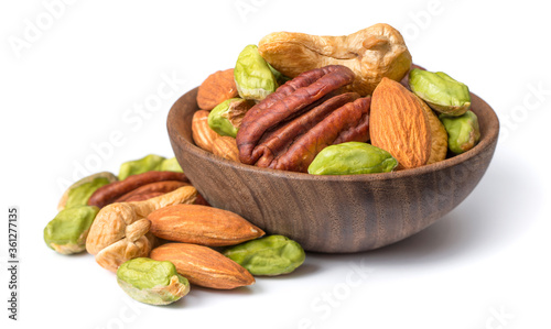 unsalted mixed nuts in the wooden bowl, isolated on white background