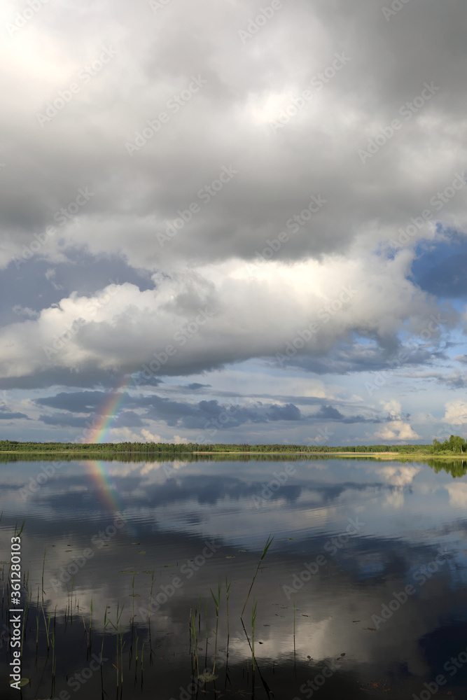 Fototapeta premium Rainbow over lake Seliger in summer
