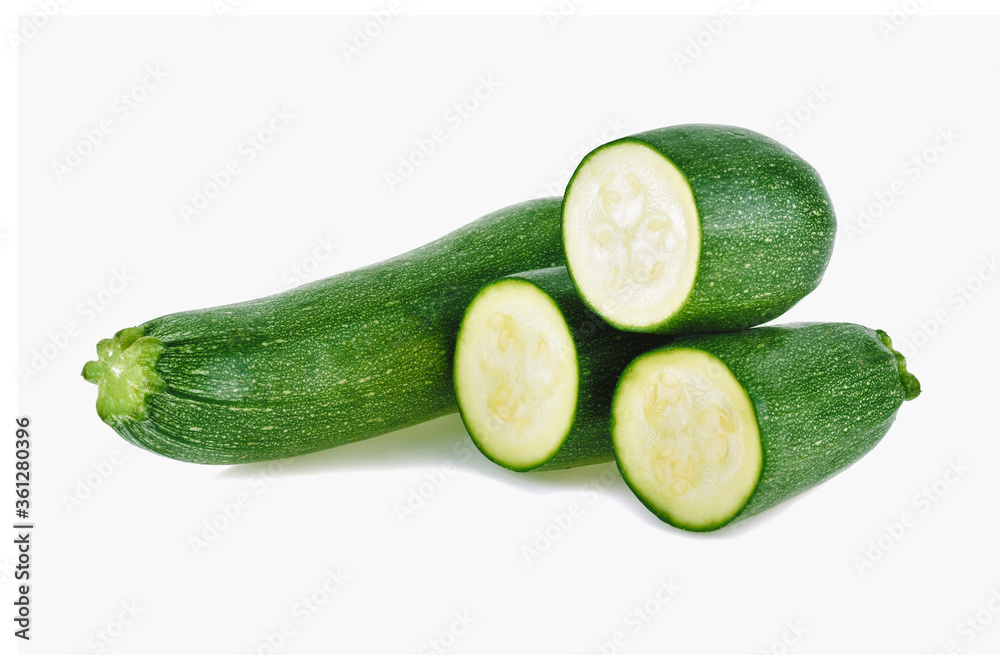 fresh green zucchini with slice isolated on white background. fresh green zucchini with slice isolated on white background.