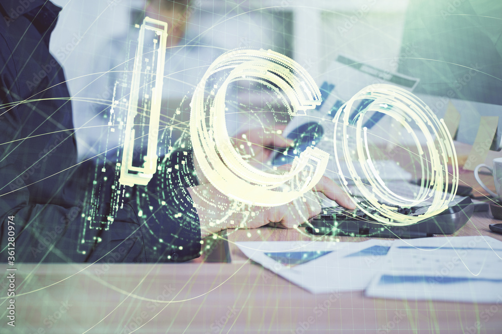 Crypto currency theme hologram with businessman working on computer on background. Concept of blockchain. Multi exposure. Crypto currency theme hologram with businessman working on computer on background. Concept of blockchain. Multi exposure.