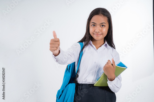 indonesian junior high school student with thumb up photo