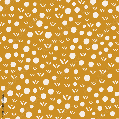 Abstract flowers and dots on mustard background. Vector seamless pattern with geometric elements and stylized signs. Hand drawn backdrop for textile, wrapping paper, flat design, kid's print.