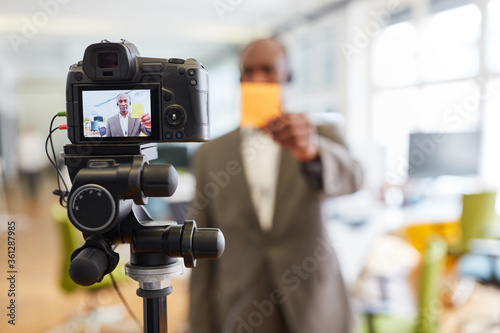 Business man recording video for a tutorial © Robert Kneschke