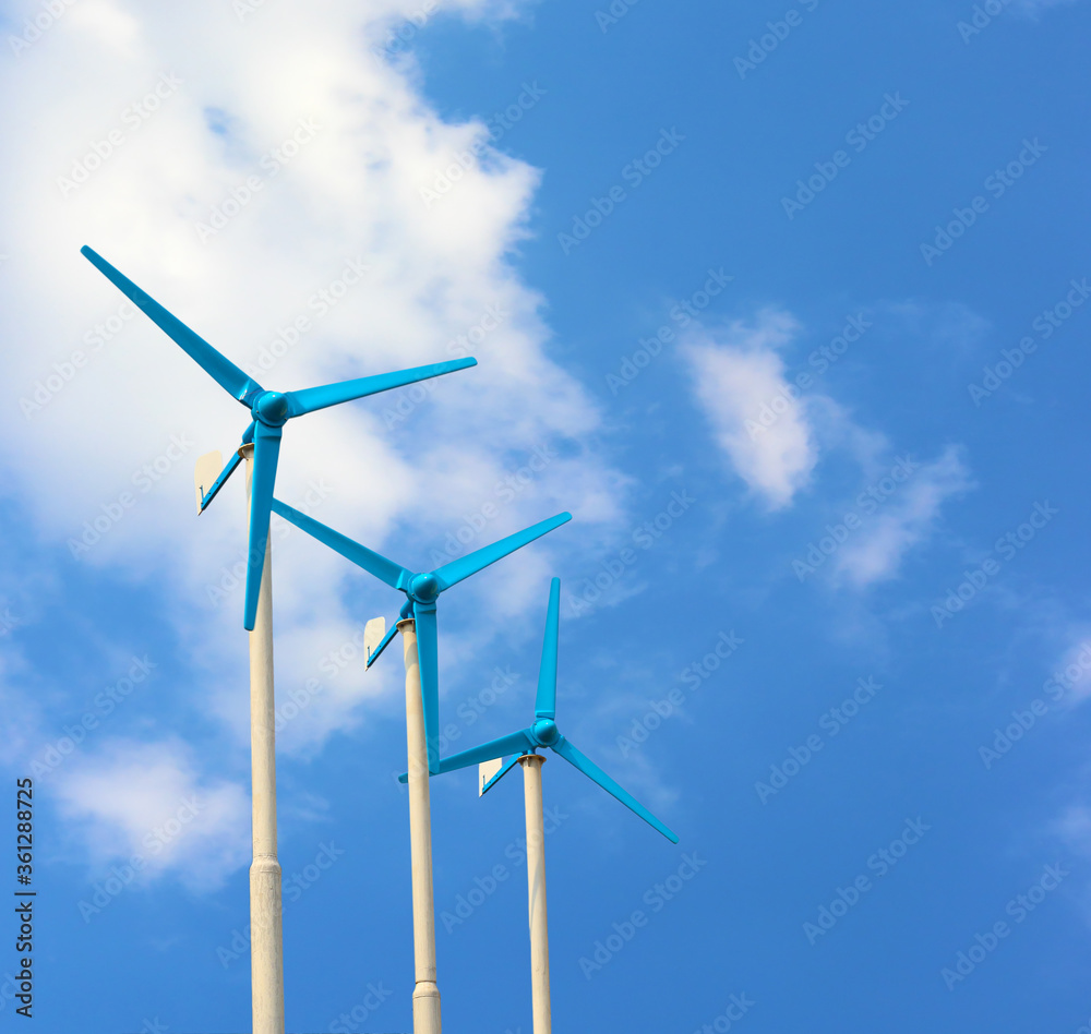 Three wind turbine generating electricity on blue sky Three wind turbine generating electricity on blue sky