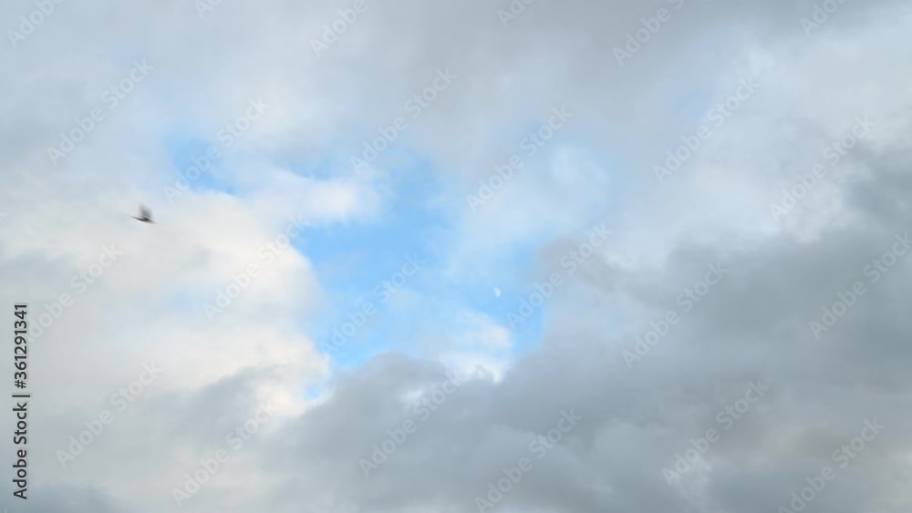 movement of clouds against a blue sky movement of clouds against a blue sky
