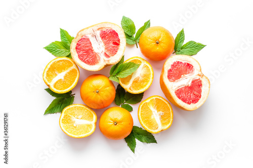 Citrus fruits grouped on white background top view