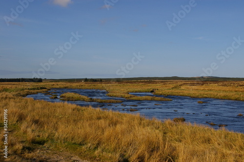 The Thurso River flowing through the flat countryside near Westerdale  Caithness  in the Scottish Highlands.