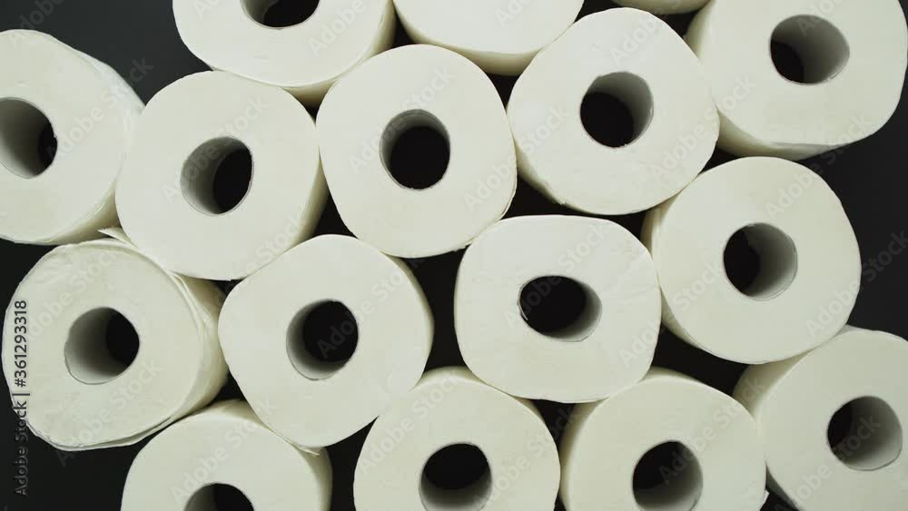 Rolls of toilet paper placed on black background Rolls of toilet paper placed on black background