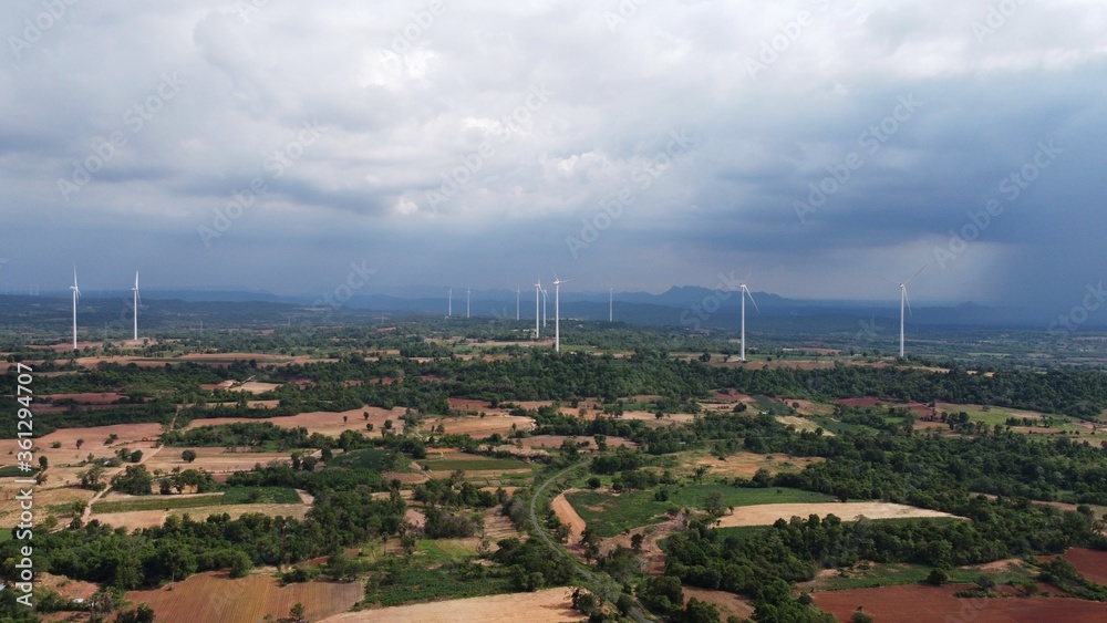 Wind turbine farm power generator in beautiful nature landscape for production of renewable green energy is friendly industry to environment. Aerial of Concept of sustainable development technology.	
