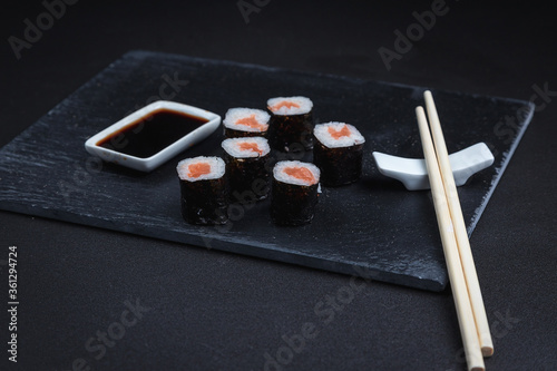 Sushi on a black background. Perfect for creating a sushi restaurant menu. Japanese cuisine  Eastern culture.