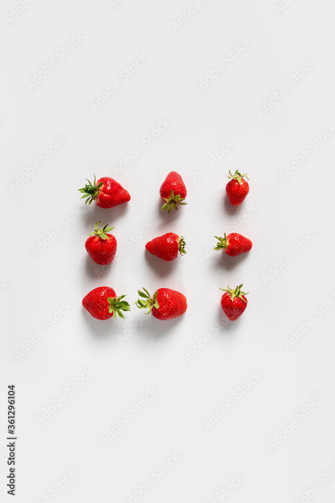 Top view background with organic and tasty strawberry berries frame on a white background Top view background with organic and tasty strawberry berries frame on a white background