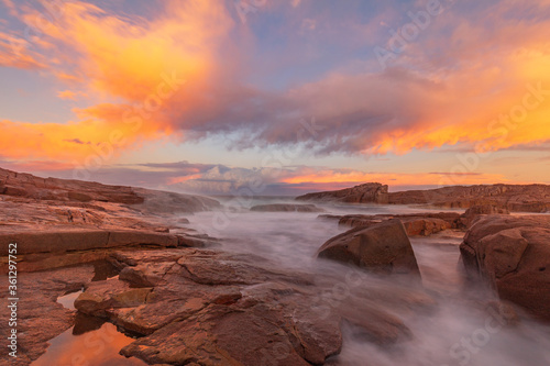 Beautiful sunset over Boat Harbour  rock shelf. Port Stephens  Hunter Region of N.S.W. Australia.