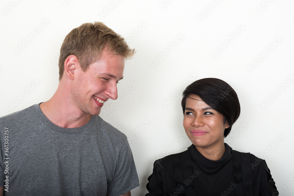 Portrait of young multi ethnic couple together Portrait of young multi ethnic couple together