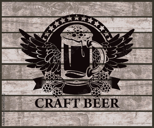 Label or banner for craft beer with overflowing glass of frothy beer, hops and wings on the background of the wooden planks. Decorative vector emblem or illustration, suitable for pub, bar, brewery