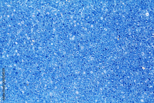 texture blue household cleaning sponge. view from above. close-up. macro photography