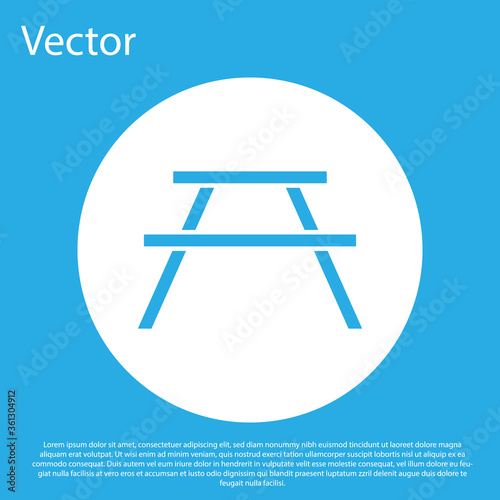 Blue Picnic table with benches on either side of the table icon isolated on blue background. White circle button. Vector Illustration.
