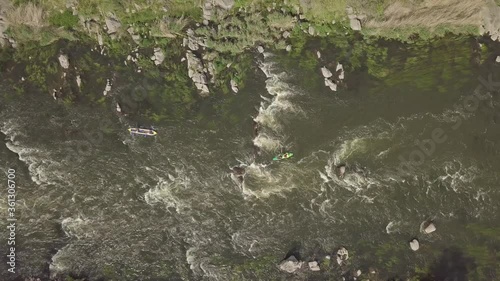 Aerial view to granite mountains and rapids on Southern Bug river with kayak and tourist on it , Mihiia village. Ukraine. Famous place for rafting and kayaking photo