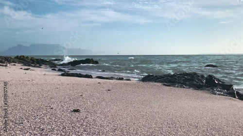 beach in the evening with table mountian in background