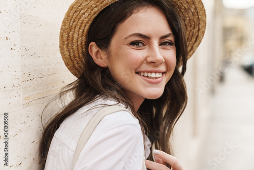 Portrait closeup of beautiful cheerful woman smiling at camera photo