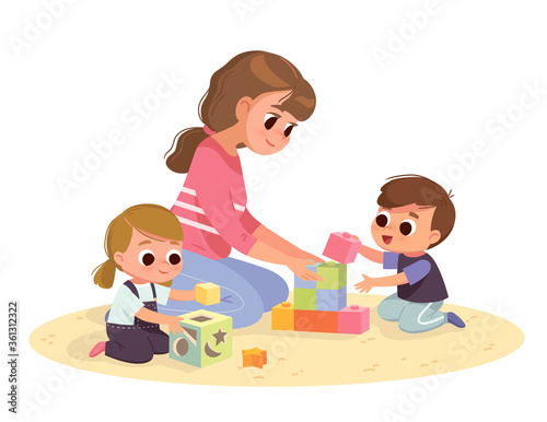 Mother playing with kids at home. Educational toys. Children playing designer cubes, developmental constructor, sorter.