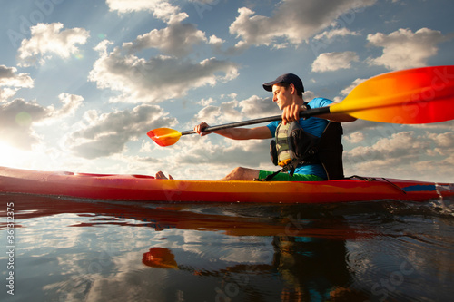Kayaking. Man paddling a kayak. Canoeing, paddling. © Victoria VIAR PRO