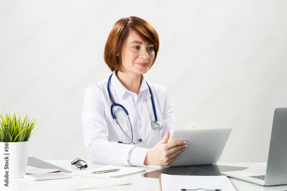 Beautiful doctor using tablet computer Beautiful doctor using tablet computer