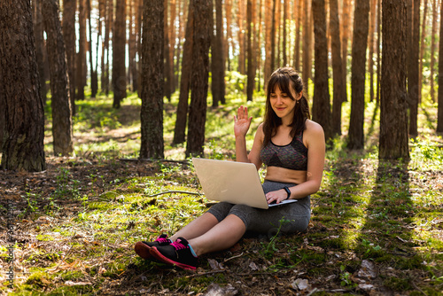 Woman online remote work outside. Laptop, computer business technology. People person forest outdoor. Escaped of office distance education concept