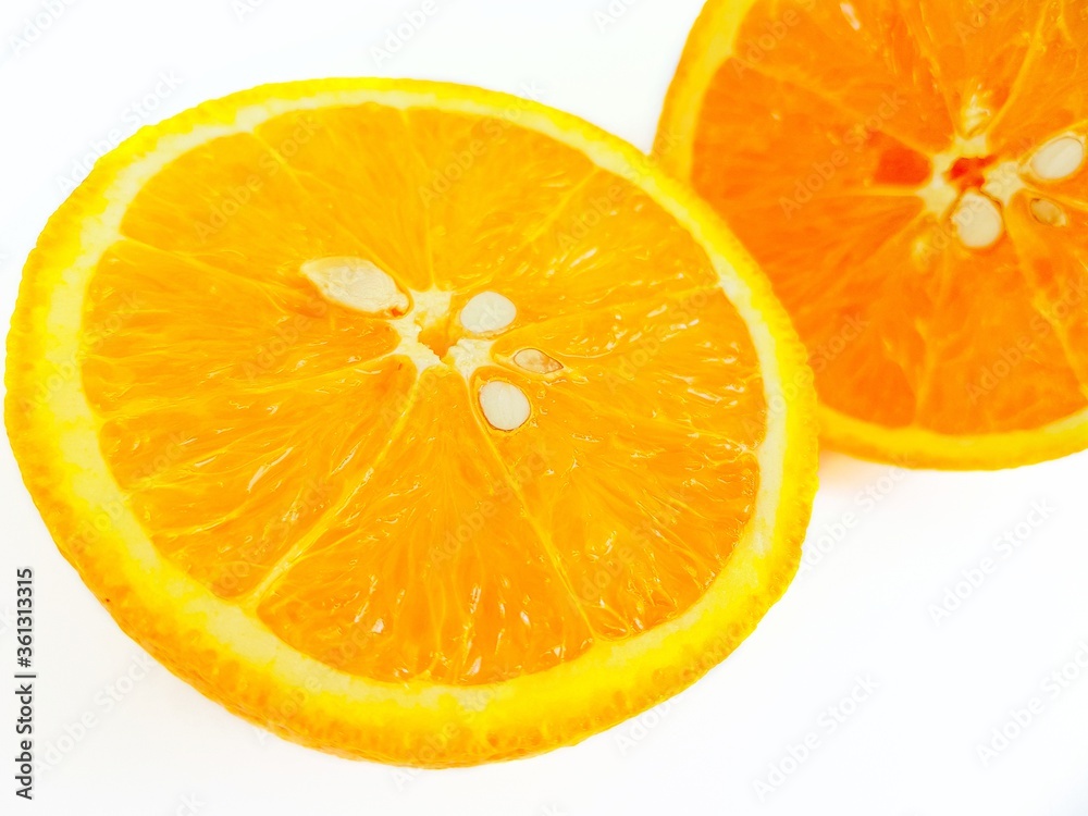 Juicy bright sweet orange on a white background close-up. Place for the buyer's text. Juicy bright sweet orange on a white background close-up. Place for the buyer's text.