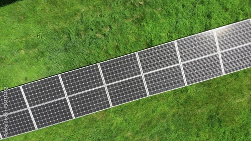 Aerial view of solar power station. Aerial top view of solar farm. Concept of clean energy, green energy, renewable energy. Alternative energy concept. Photovoltaic panels. 