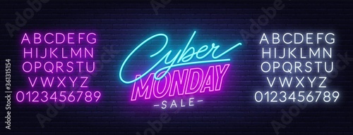 Cyber Monday sale neon sign. Neon alphabet on brick wall background. Template for a design.