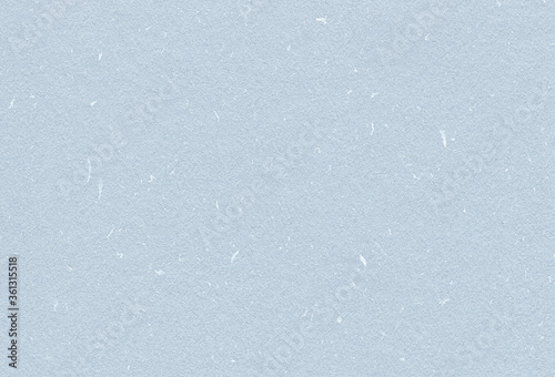 Close up view of light blue rough recycled paper background. Extra large highly detailed image.