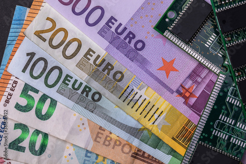 5 euro banknotes next to the micro-schemes. Top view. photo