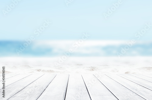 Fototapeta Naklejka Na Ścianę i Meble -  Wooden table top on blue sea and white sand beach background.