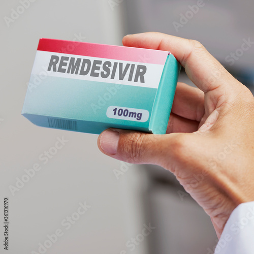 man with a simulated box of remdesivir