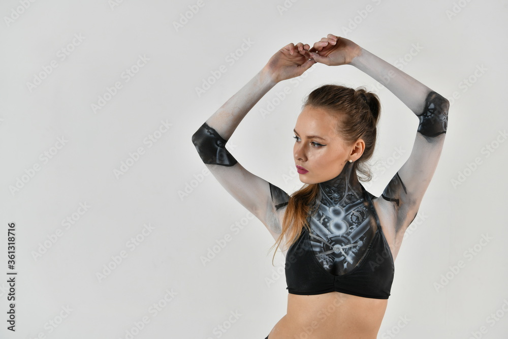 girl in a robot suit posing on a white background