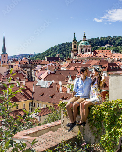 Photography Couple sitting in Prague garden with view of Malostranske square and Little side