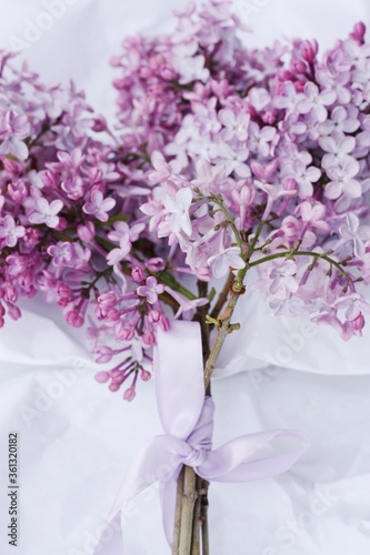 Beautiful bouquet of lilac on white paper 
