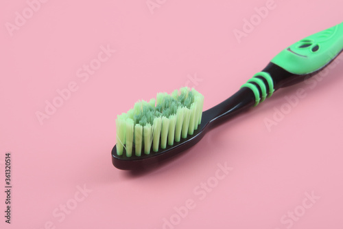 Tooth brush isolated on pink background 