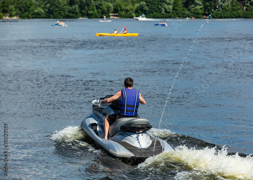 Man rides a jet ski on a river