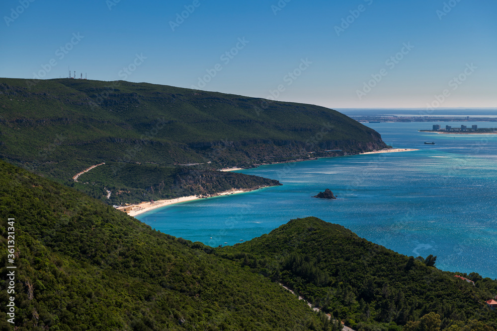 Scenic view of a bay with boats at the Arrabida Natural Park near Setubal, Portugal; Concept for summer vacations and travel in Portugal