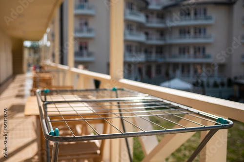 Empty net for drying things flooded with sunlight. Dryer for things in a motel in sunny weather.