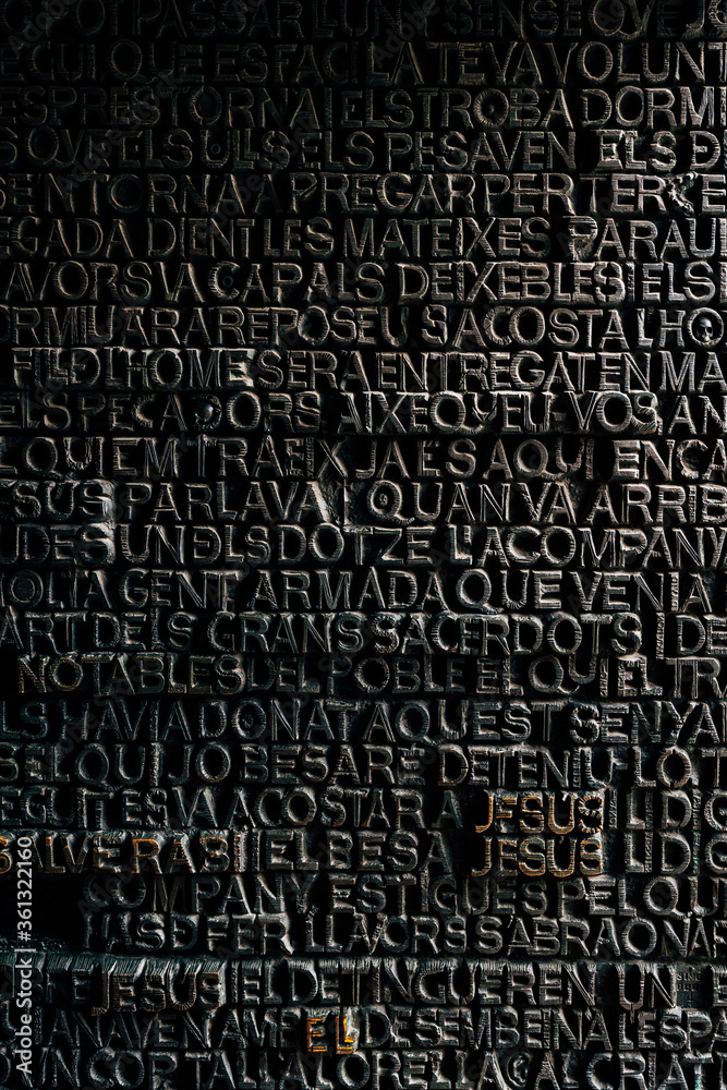 Word Jesus - the detail of the inscription on the main door of Sagrada Familia Catholic Church constructed by Antoni Gaudi in Barcelona