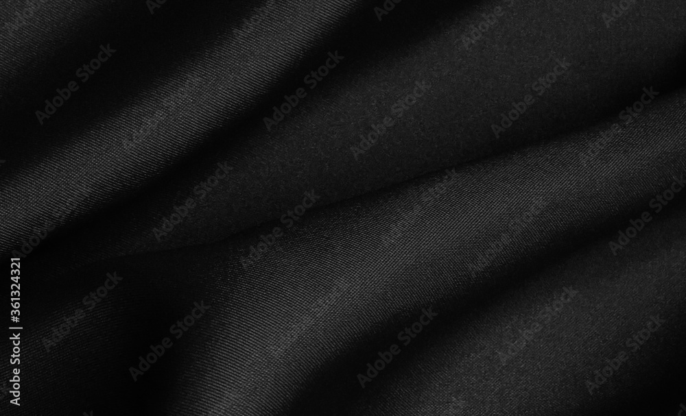 Obraz premium Black folded fabric. Liquid wavy background.