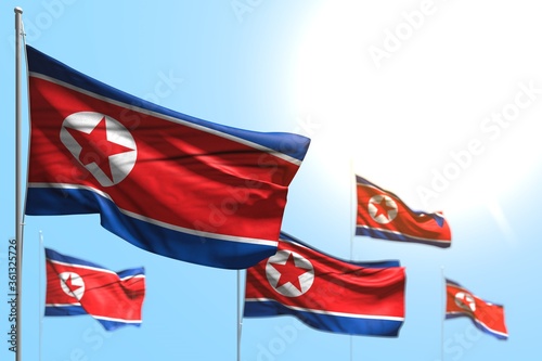 cute 5 flags of North Korea are wave against blue sky photo with bokeh - any celebration flag 3d illustration..