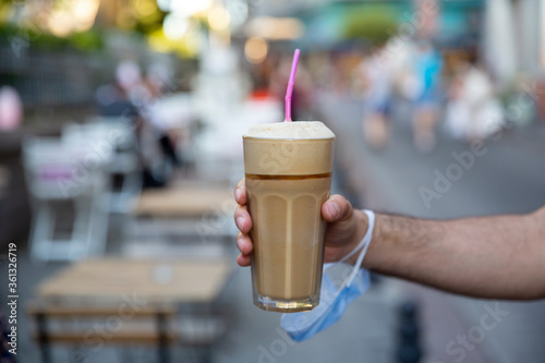 close up man hand holding frappe, selective focus