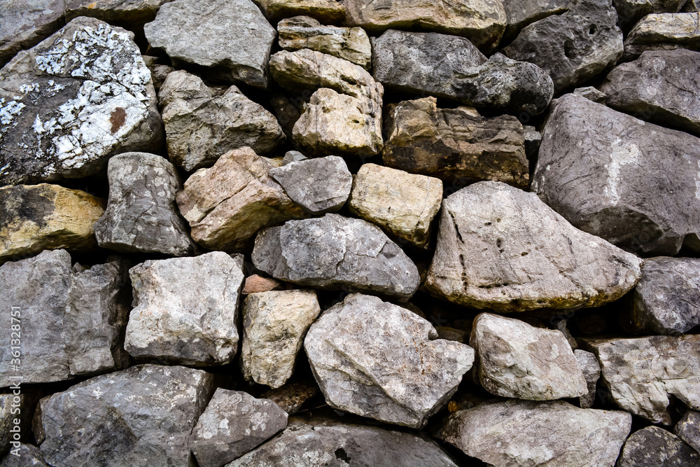 Pattern of decorative nature stone wall background in the park