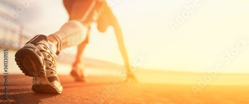 Athlete runner run on start at treadmill photo