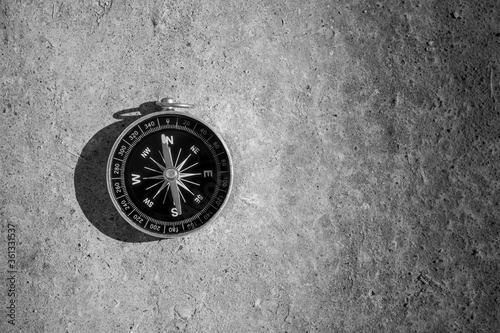 Compass on the ground. - travel and transportation concept.