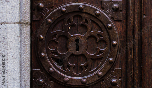 Beautiful keyhole on old wooden doors.