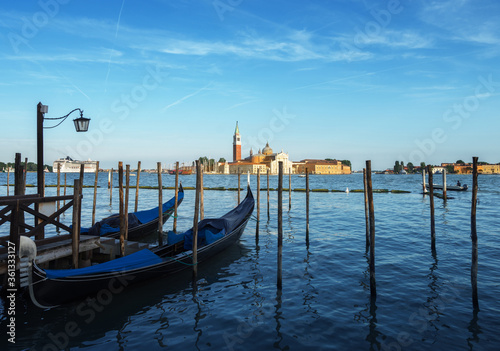Gondolas on Grand Canal and San Giorgio Maggiore church in Venice © Iakov Kalinin